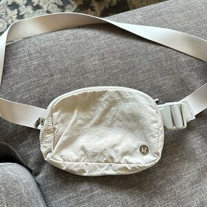 Cream Lululemon Fanny pack , has a little pink stain on the back.
